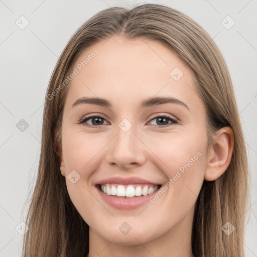 Joyful white young-adult female with long  brown hair and grey eyes