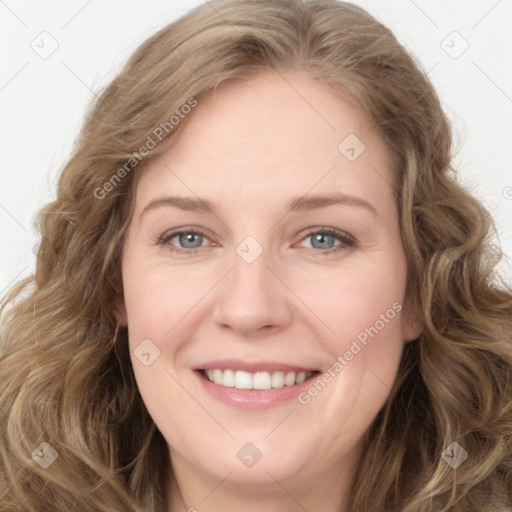 Joyful white young-adult female with long  brown hair and green eyes