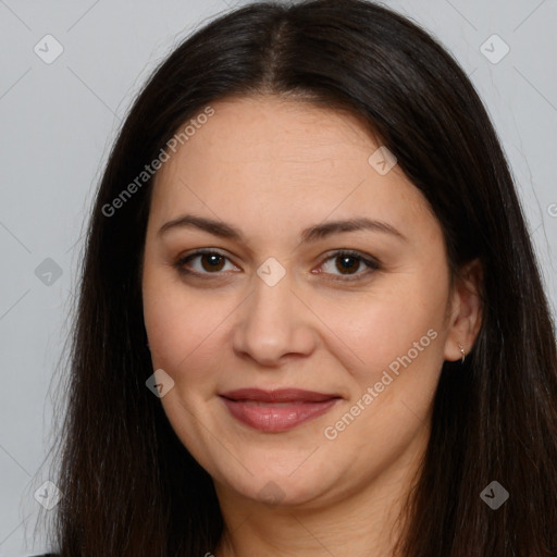 Joyful white adult female with long  brown hair and brown eyes