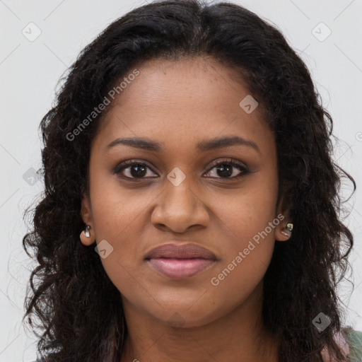 Joyful black young-adult female with long  brown hair and brown eyes