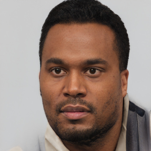 Neutral black young-adult male with short  black hair and brown eyes