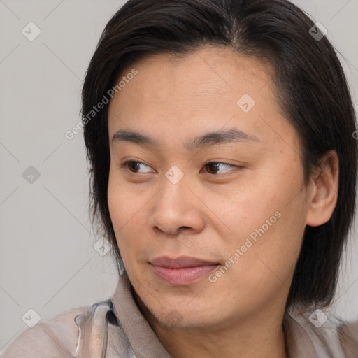 Joyful white young-adult female with medium  brown hair and brown eyes