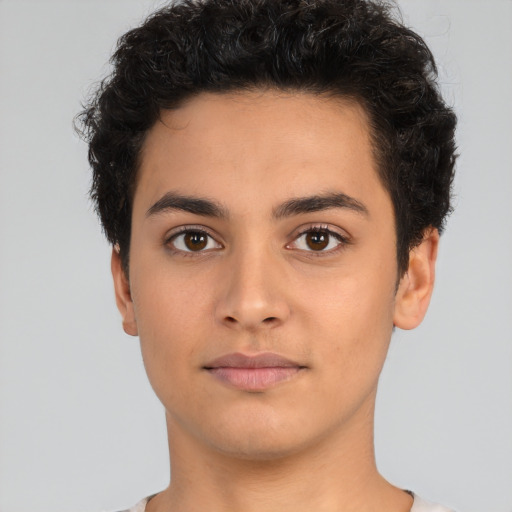 Neutral latino young-adult male with short  brown hair and brown eyes
