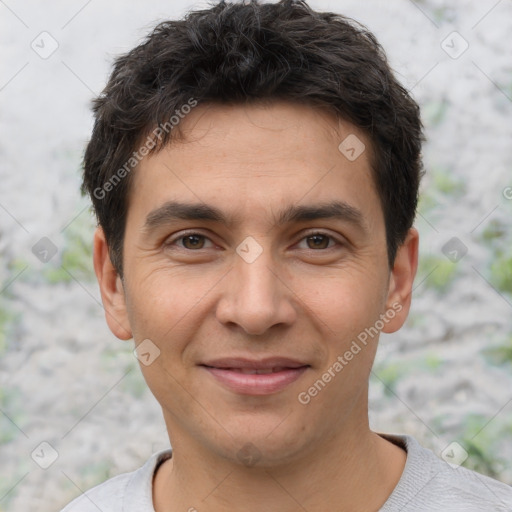 Joyful white young-adult male with short  black hair and brown eyes