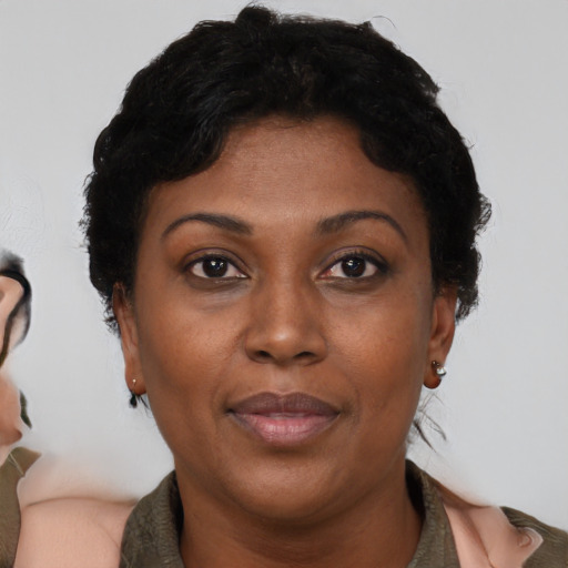 Neutral black adult female with short  brown hair and brown eyes