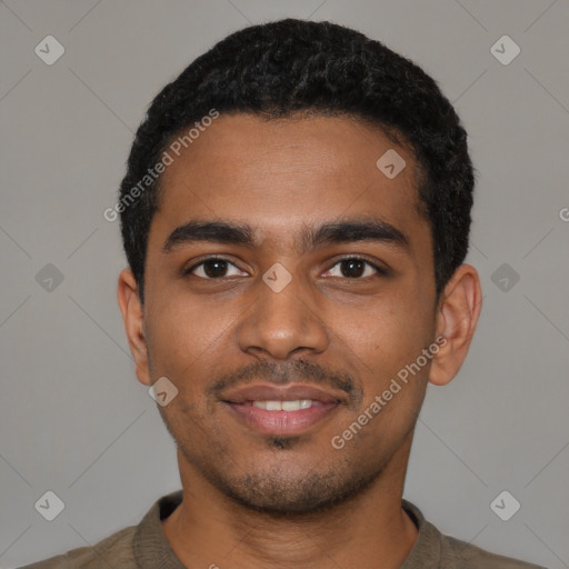 Joyful black young-adult male with short  black hair and brown eyes