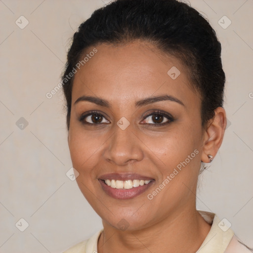 Joyful latino young-adult female with medium  brown hair and brown eyes