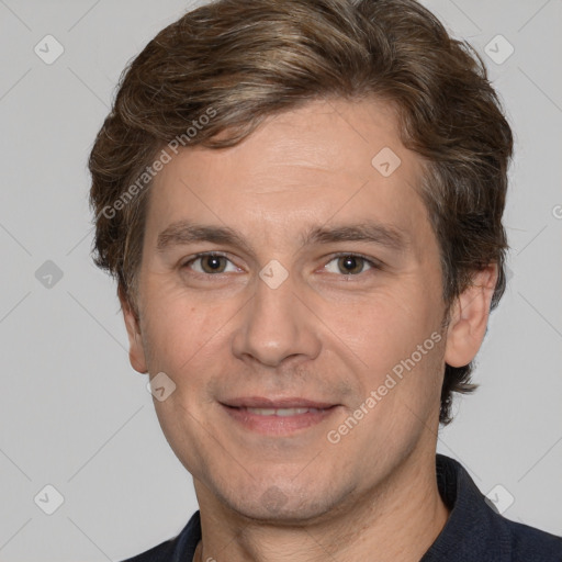 Joyful white adult male with short  brown hair and brown eyes