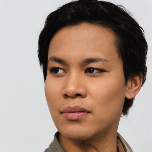 Joyful asian young-adult female with short  black hair and brown eyes