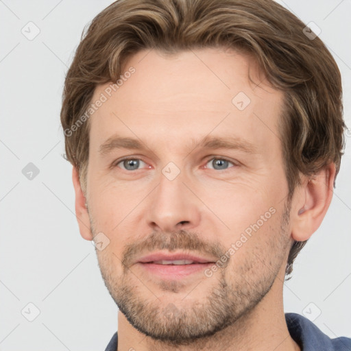 Joyful white adult male with short  brown hair and grey eyes