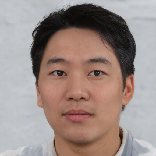 Neutral asian young-adult male with short  black hair and brown eyes
