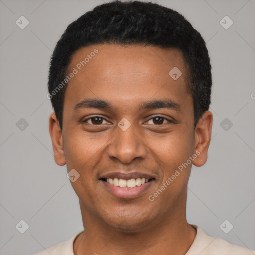 Joyful black young-adult male with short  black hair and brown eyes