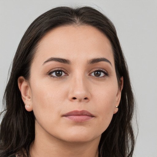 Neutral white young-adult female with long  brown hair and brown eyes