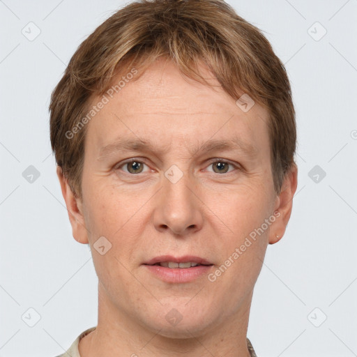 Joyful white adult male with short  brown hair and grey eyes