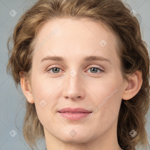 Joyful white young-adult female with medium  brown hair and blue eyes