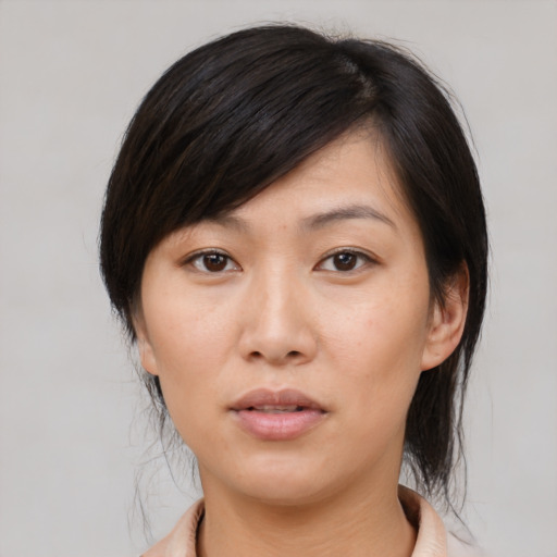 Neutral asian young-adult female with medium  brown hair and brown eyes