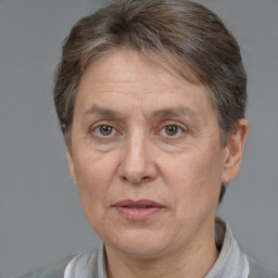 Joyful white middle-aged female with short  brown hair and brown eyes