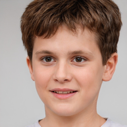 Joyful white child male with short  brown hair and brown eyes