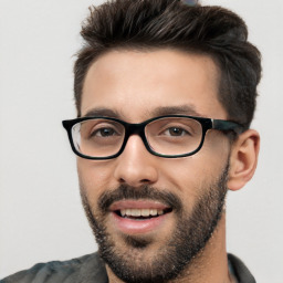 Joyful white young-adult male with short  black hair and brown eyes