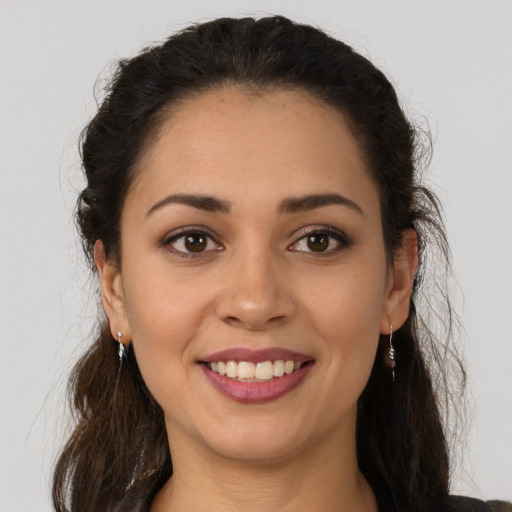 Joyful white young-adult female with long  brown hair and brown eyes