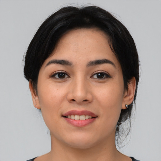 Joyful asian young-adult female with medium  black hair and brown eyes