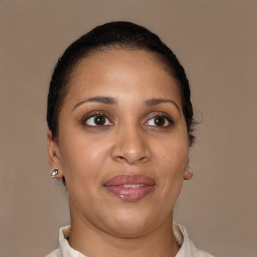 Joyful latino young-adult female with short  brown hair and brown eyes