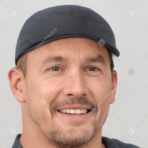 Joyful white adult male with short  brown hair and grey eyes