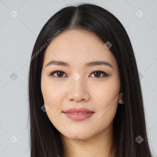 Joyful latino young-adult female with long  black hair and brown eyes