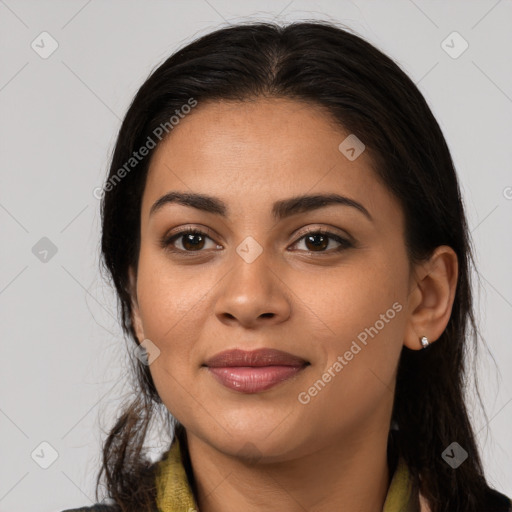 Joyful latino young-adult female with long  brown hair and brown eyes