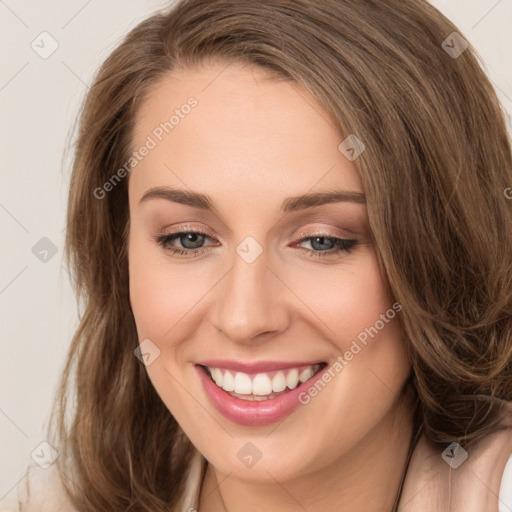 Joyful white young-adult female with long  brown hair and green eyes