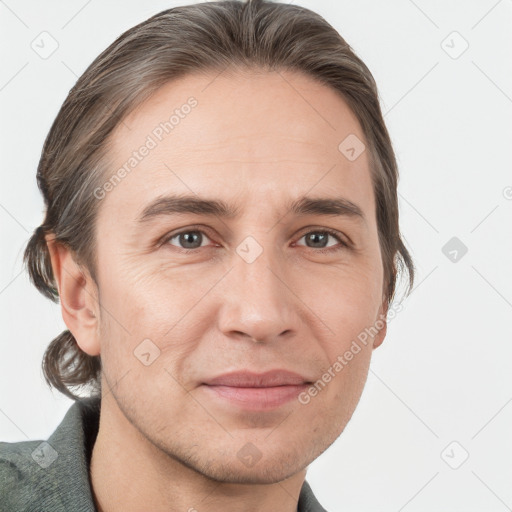 Joyful white adult male with short  brown hair and grey eyes