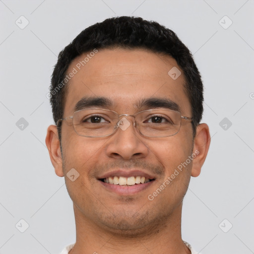 Joyful latino young-adult male with short  black hair and brown eyes