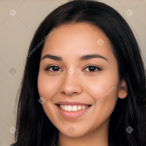 Joyful latino young-adult female with long  black hair and brown eyes