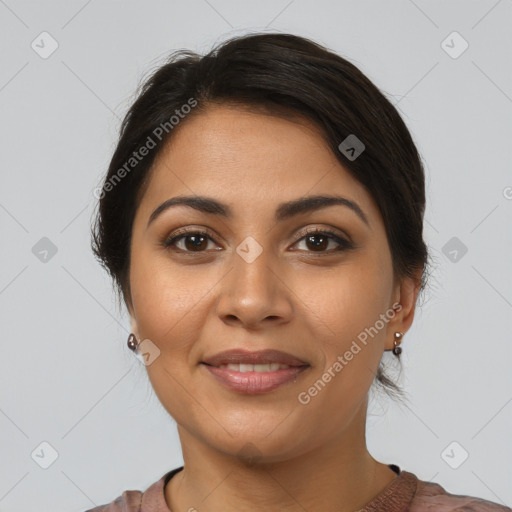 Joyful latino young-adult female with short  brown hair and brown eyes