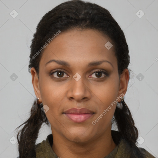 Joyful black young-adult female with long  brown hair and brown eyes