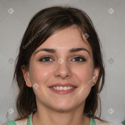 Joyful white young-adult female with medium  brown hair and blue eyes