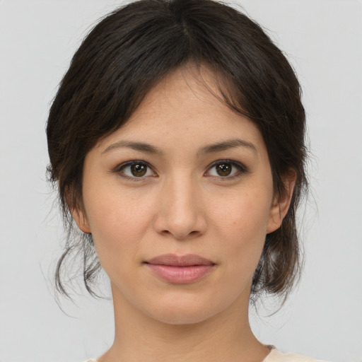 Joyful asian young-adult female with medium  brown hair and brown eyes