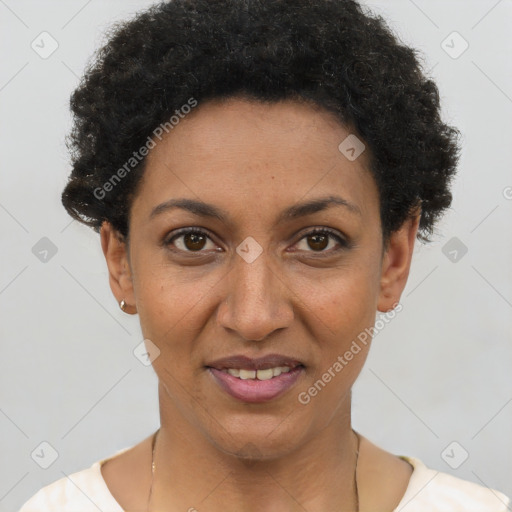 Joyful black young-adult female with short  black hair and brown eyes