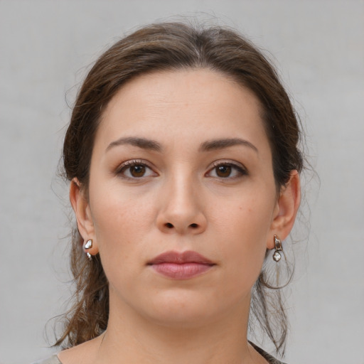 Neutral white young-adult female with medium  brown hair and brown eyes