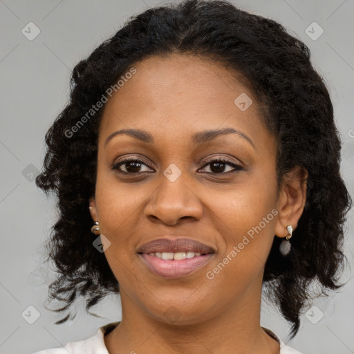 Joyful black young-adult female with medium  brown hair and brown eyes