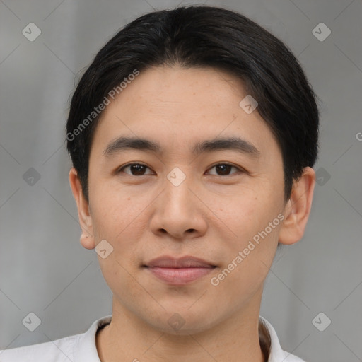 Joyful asian young-adult male with short  brown hair and brown eyes