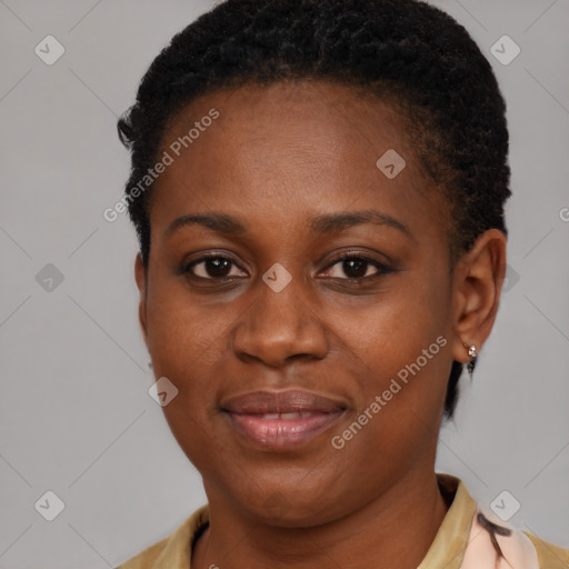 Joyful black young-adult female with short  brown hair and brown eyes