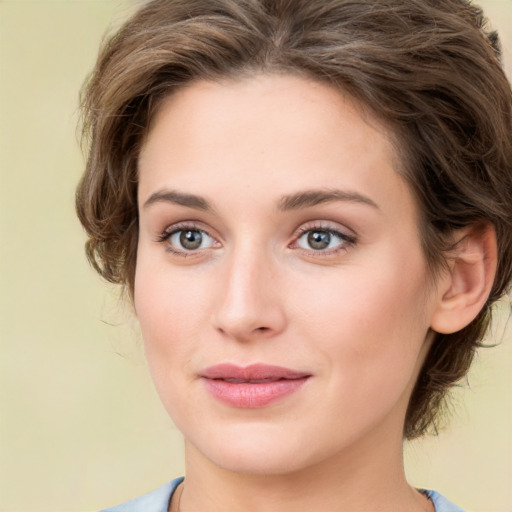 Joyful white young-adult female with medium  brown hair and green eyes