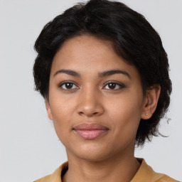 Joyful latino young-adult female with short  brown hair and brown eyes