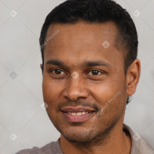 Joyful latino young-adult male with short  black hair and brown eyes