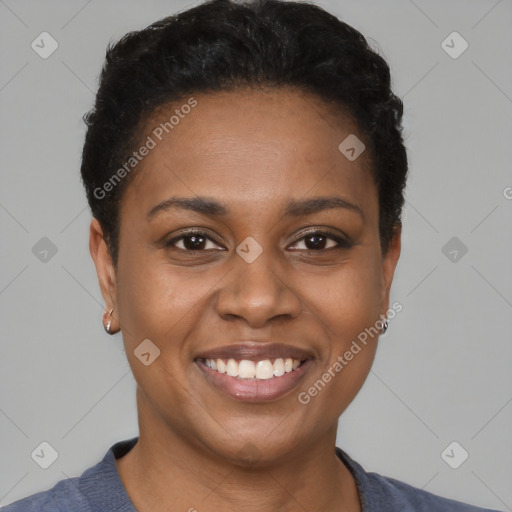 Joyful black young-adult female with short  brown hair and brown eyes