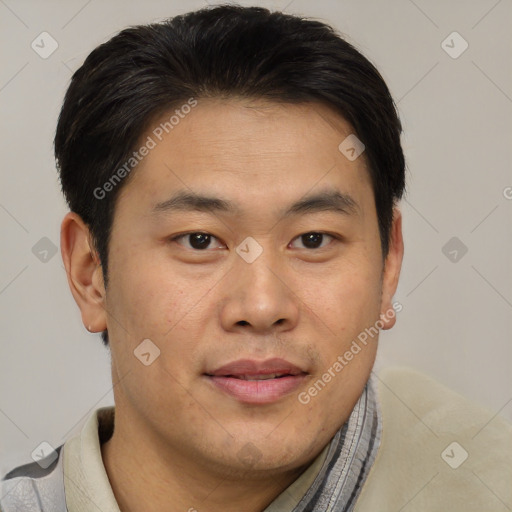 Joyful asian young-adult male with short  brown hair and brown eyes