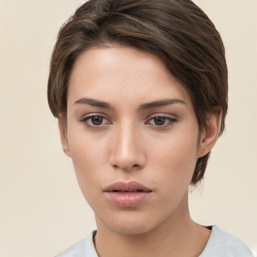 Neutral white young-adult female with short  brown hair and brown eyes