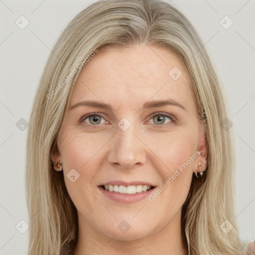 Joyful white young-adult female with long  brown hair and blue eyes