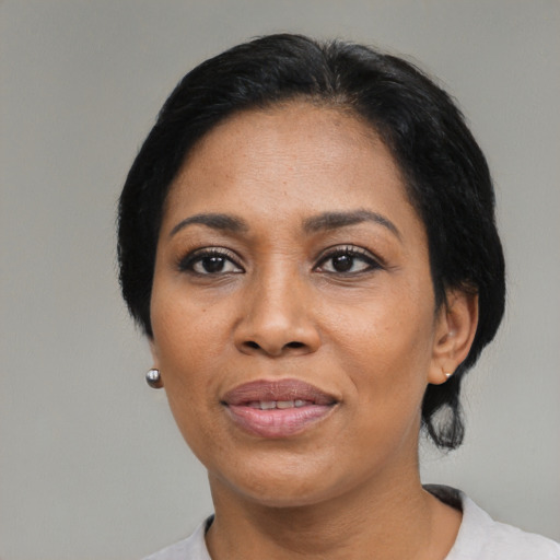 Joyful asian adult female with medium  black hair and brown eyes
